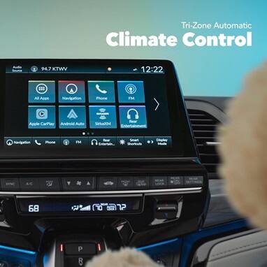 2027 Honda Odyssey Elite detail of the infotainment screen and tri-zone automatic climate control (Minivan).