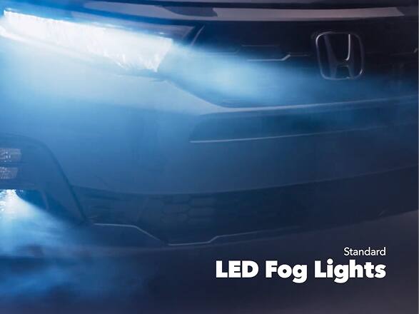 2027 Honda Odyssey Elite in Smoke Blue Pearl front studio showing standard LED fog lights and headlights (Minivan).